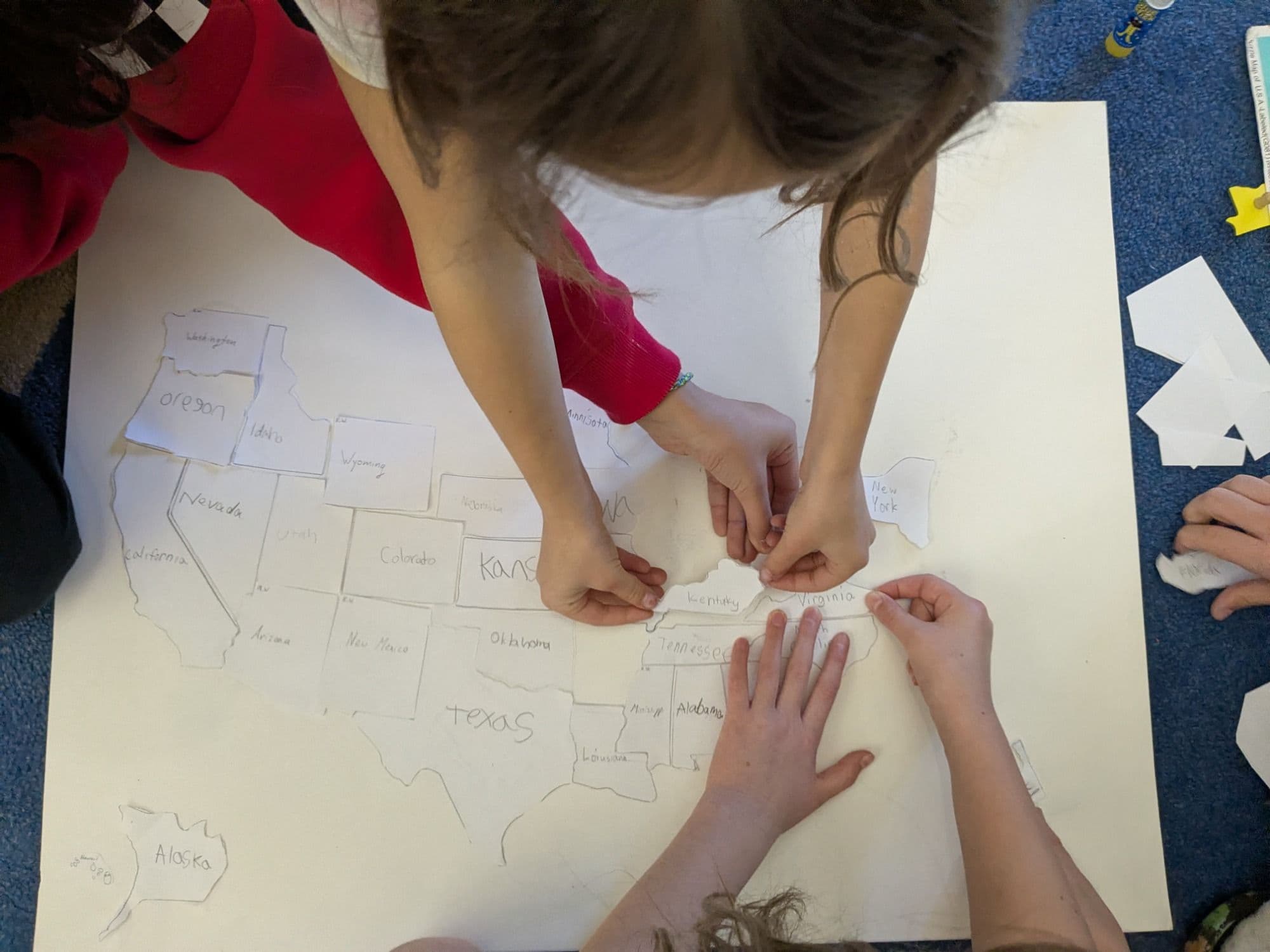Students at Meadow View assembling a hand-drawn map of the United States
